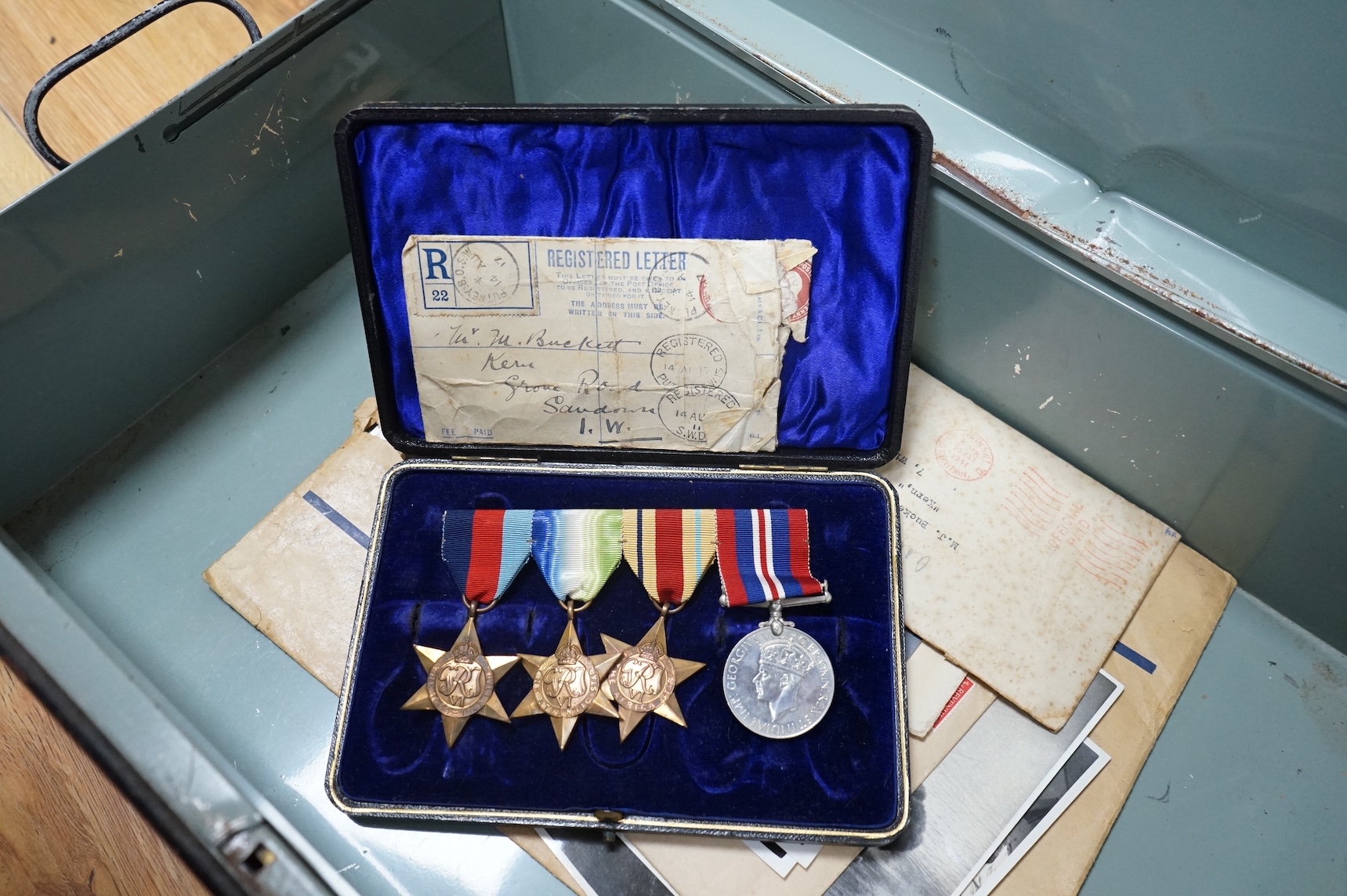 H.M.S. Hood related interest; a WWII medal group awarded to Midshipman P.J. Buckett R.N.V.R, comprising; the Atlantic Star, the Africa Star, the 1939-1945 Star and the 1939-1945 Medal, engraved with his name to the rear